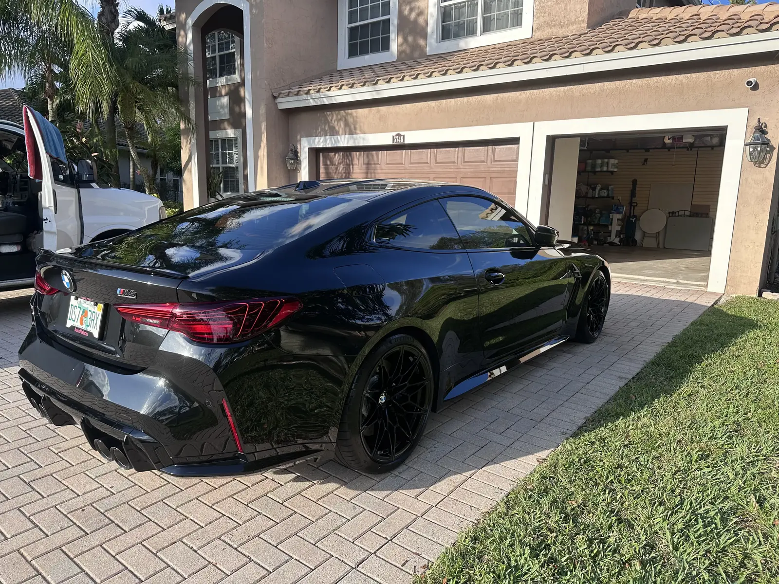 Black BMW M4 rear view after full exterior detail in South Florida