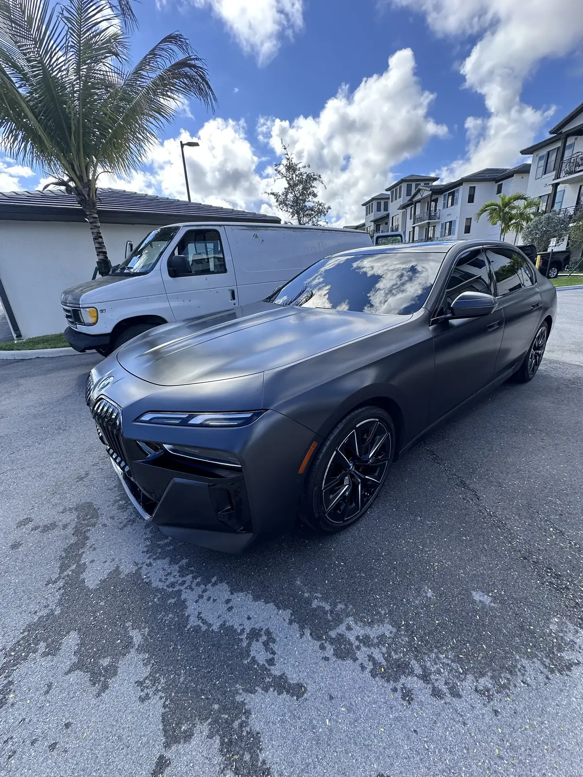 Matte gray BMW 7 Series front view after mobile detailing in Broward County