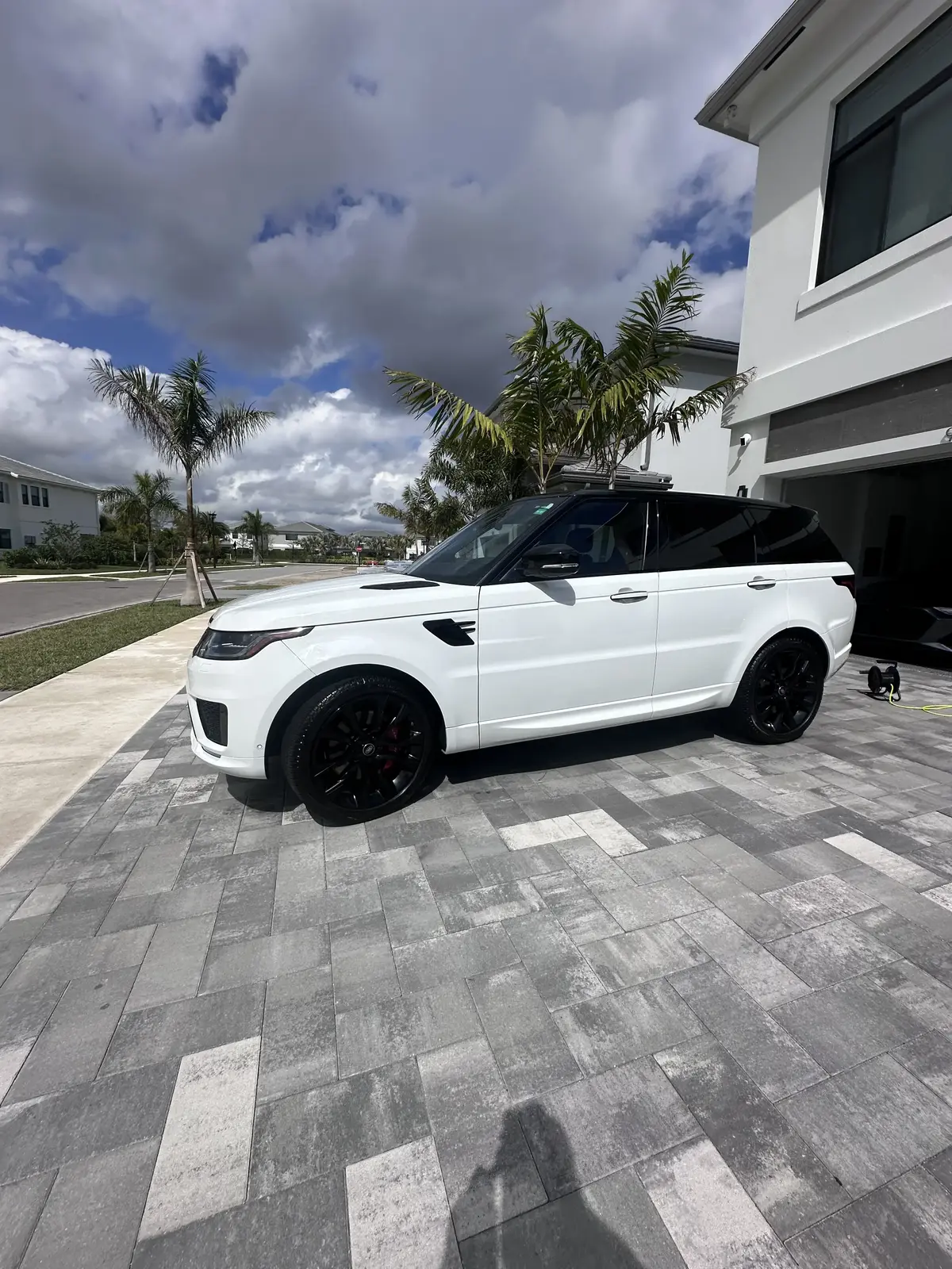 White Range Rover Sport after full detail at luxury home in Palm Beach