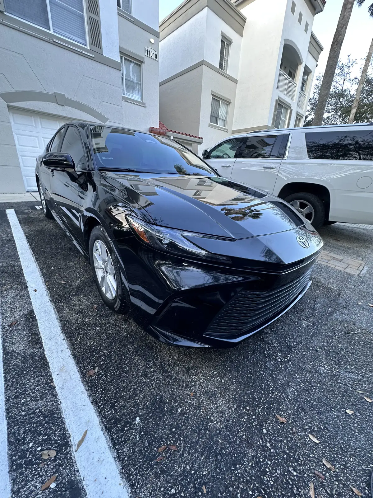 Black Toyota Camry exterior after professional detailing in Broward County