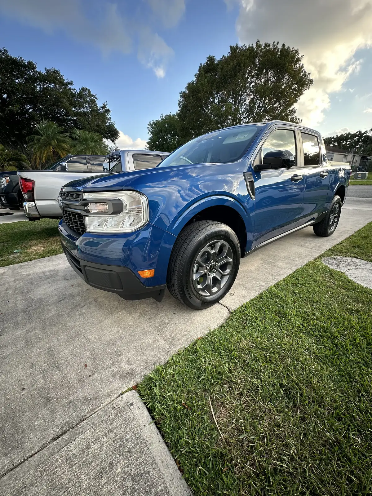 Blue Ford Maverick truck after exterior hand wash and detail in South Florida