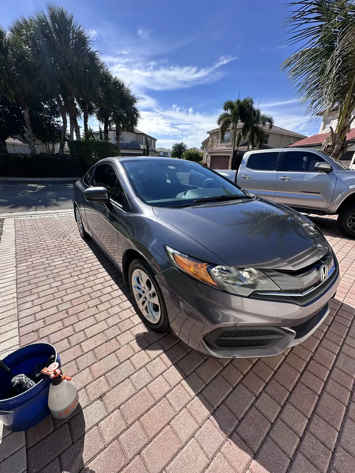 Gray Honda Civic coupe during mobile detailing service at home in Broward County